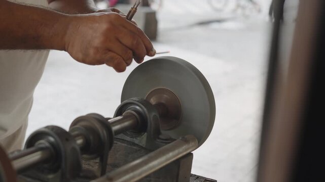 Street craftsman sharpening nail cleaner tool manually