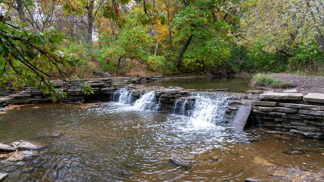 Small Autumn Waterfall Over Rocky Stream &ndash; Serene Fall Nature Scene