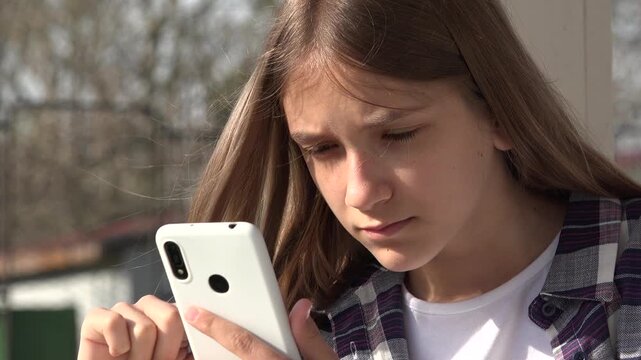 Adolescent Girl Playing Smartphone, Kid Browsing Internet on Smart Phone in Park, Teenager Child use Devices Outdoor at Playground