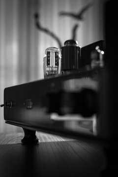 Vacuum tube silhouette in a handmade High-End Tube Amplifier. Black and white picture