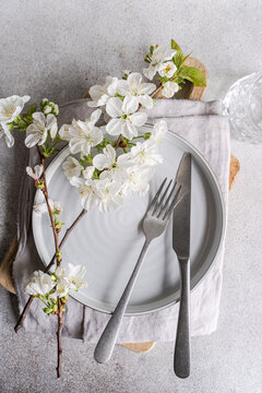 Spring floral themed table setting with cherry blossom