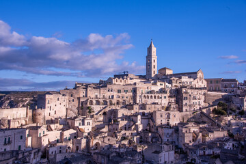Obraz premium Carved into stone and shaped by centuries, Matera rises from the rocks of southern Italy like a timeless masterpiece. 