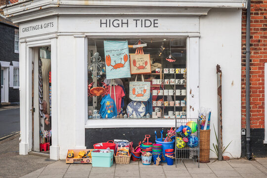 Window display at the independent gift shop High Tide, showing local souvenirs, coastal themed decor and beach items, in Southwold, Suffolk, UK