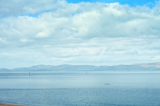 Panoramic view of distant Cooley Mountains across Dundalk Bay from Annagassan coast County Louth Ireland.