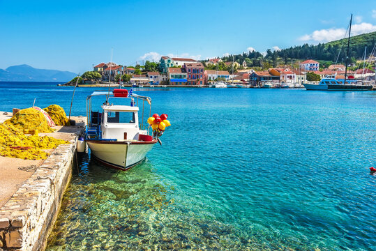Beautiful scenic landscape with a boat on the embankment in Nydri, Lefkada, Greece. Stunning amazing charming places.
