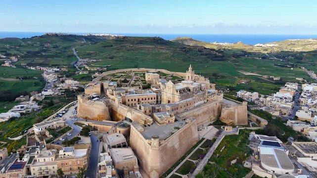 Cittadella Il Kastell in Victoria Rabat Gozo Malta reveals fortified bastions and Cathedral of the Assumption It Tlugħ ta Marija overlooking central plateau and surrounding countryside, drobe orbiting