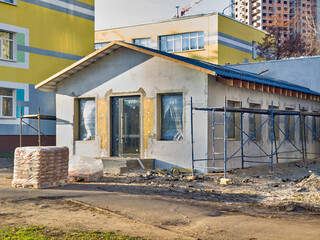 Naklejka premium Construction of a technical extension to a school building
