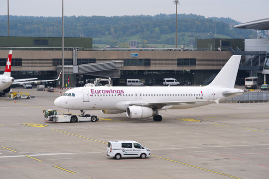Avion Express passenger airplane type Airbus A320-232 registration 9H-AMJ pushback at Swiss Z&uuml;rich Airport on a cloudy autumn day. Photo taken October 3rd, 2025, Zurich Airport, Switzerland.