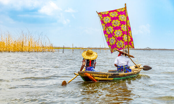 Fishermen in a small boat at lake Nokou&eacute; in Benin, West-Africa
