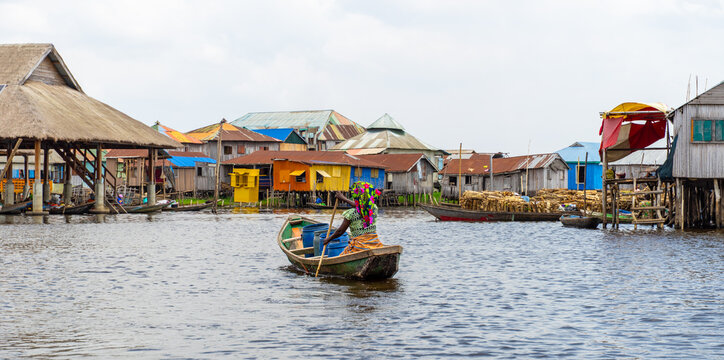 Fishermen in a small boat at lake Nokou&eacute; in Benin, West-Africa