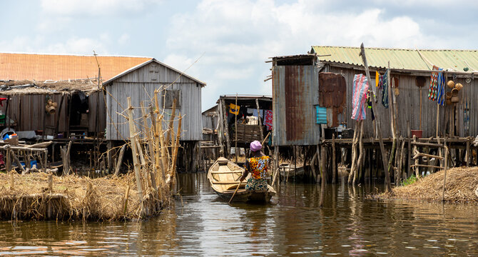 Fishermen in a small boat at lake Nokou&eacute; in Benin, West-Africa