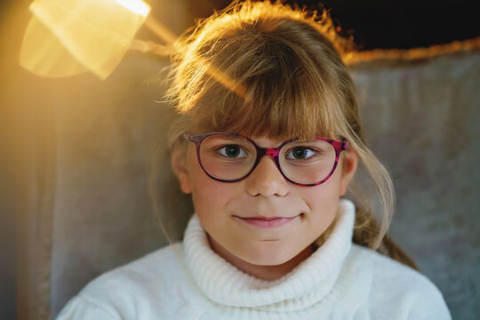 Portrait of little cute girl with eyeglasses. Happy child.