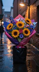 Naklejka premium Sunflower bouquet placed in bag on wet urban alleyway