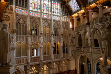 Naklejka premium Utrecht, Netherlands - 26 May 23: Grand Gothic Revival hall interior at Castle De Haar