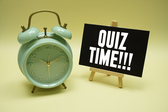 Quiz Time text message and alarm clock on yellow background