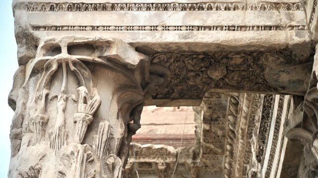 Ancient roman temple ruins, detailed carvings on stone columns, historical landmark with motion.