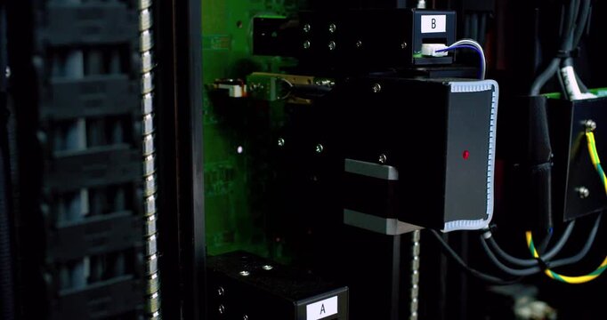 Modern production. Automated high-precision board manufacturing machine Produces printed digital electronic boards. Automatic assembly of smd components. Electronic chip production close-up.