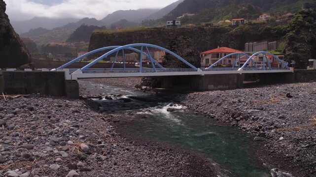 Modern Blue Bridge Over River in Madeira Mountain Valley