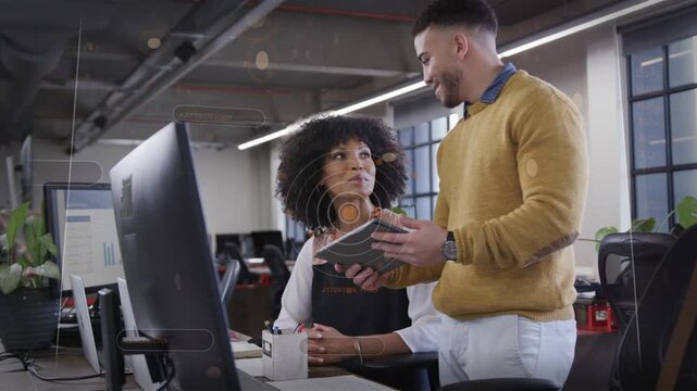 man showing swatch to woman at desk, seeking design feedback while HUD circles highlighting samples
