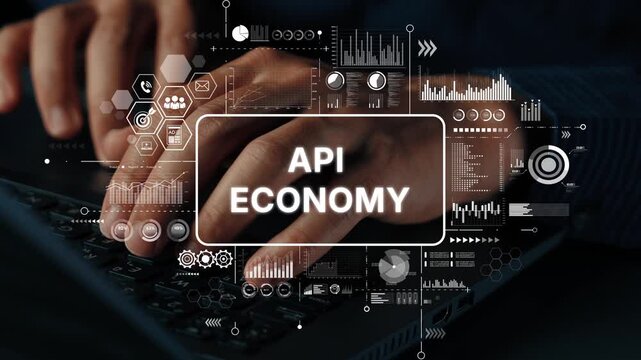 Hands typing on laptop with overlay of data visuals representing the concept of API Economy in modern digital business landscape. Asymptotic smart data analytic.