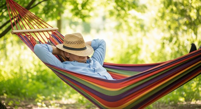 Man relaxing in a colorful hammock in a lush forest. A serene scene conveying tranquility and peace. Summer relaxation, peaceful escape, vacation lifestyle.