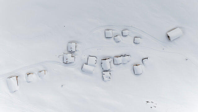 Winter landscape, aerial view of snow covered huts in a mountain village, tourism concept. Sennes refuge,Sennes Braies Natural Park,Alto Adige,Veneto,Italy