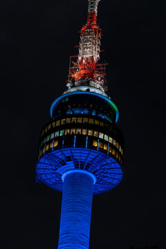 Close up of N Seoul Tower illuminated with blue light at night
