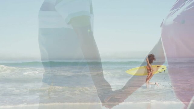 Overlaid couple holding hands over shore, surfer entering right, wading waves with yellow board ads