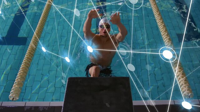 Male swimmer shifting legs, pushing into backstroke start while sports tech overlay tracking form