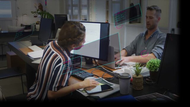 Two office staff using UI, highfiving over divider celebrating resuming typing as peer walking past