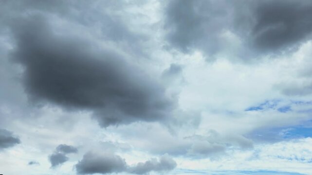 Peterborough, England, UK - April 14 2026: A bright spring afternoon turns quickly into a dark and stormy sky. Time lapse.