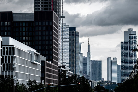 Urban street in bankenviertel frankfurt germany under heavy clouds as modern office architecture shapes a moody skyline with strong lines