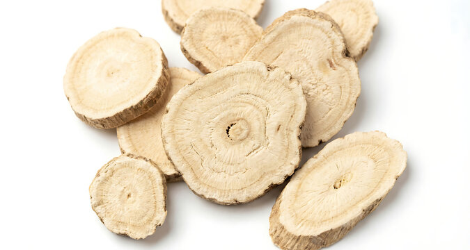 Sliced Dried Astragalus Root on White Background