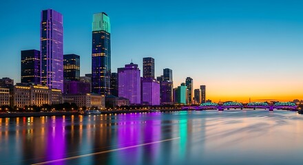 Obraz premium City skyline at sunset with river.