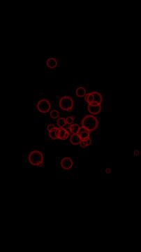 Vertical animation of glowing red bubble or ring-shaped particles floating and pulsing in the center of a black screen