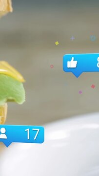 Vertical video: Bubbles popping, stacked burger sliding in, confetti marking social engagement