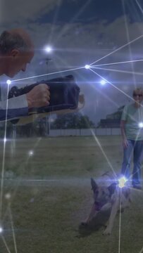 Handler giving cue on training field, dog biting trainer sleeve for control, animated force overlay