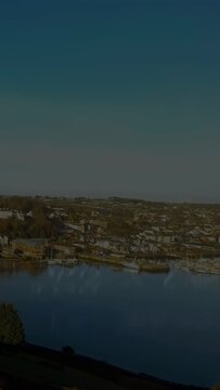 Vertical video: Science overlay starting above coastal harbor, formulas rising, drifting over sea