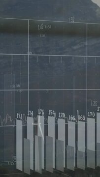Vertical video: Faint grid appearing, turbine turning while 3D bars populating to show wind power
