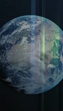 Vertical video: Earth appearing and rotating CW as green beams shifting showing clouds and coasts