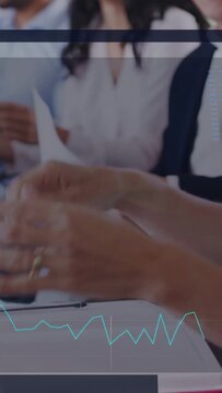 Vertical video: Business team shifting notes to clapping after host showing results with blue chart