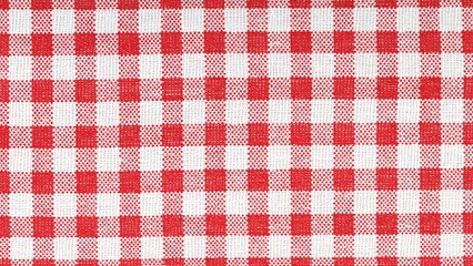 Red and white checkered cotton fabric texture close up