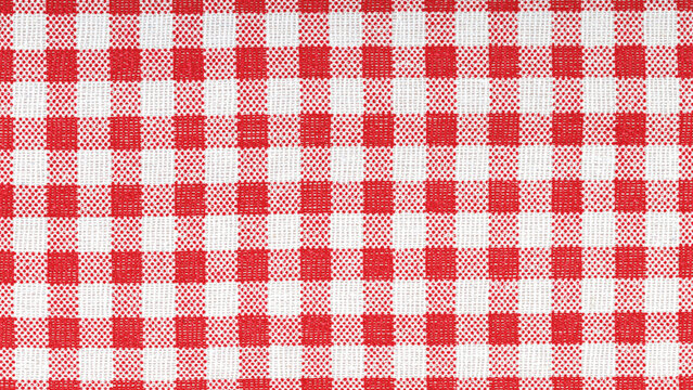 Red and white checkered cotton fabric texture close up