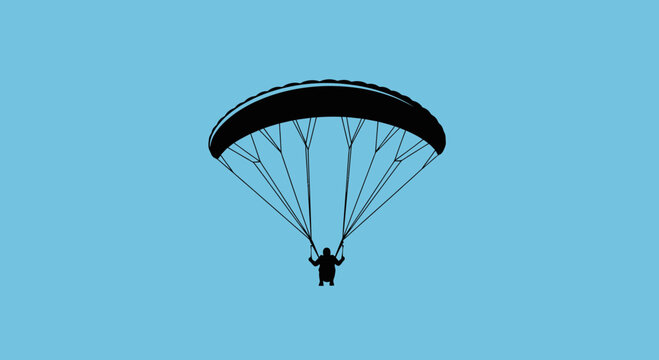 Paraglider Silhouette Floating Gracefully Against a Vibrant Blue Sky