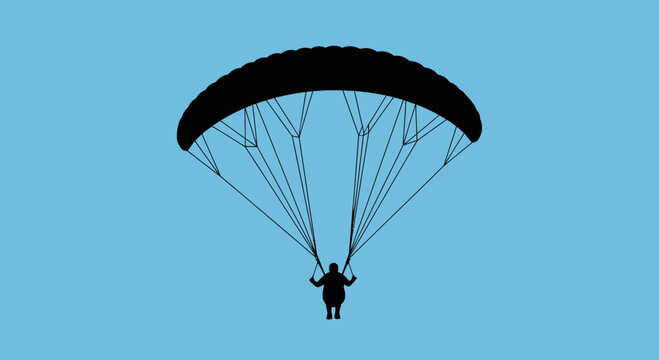 Paragliding Silhouette Against A Clear Blue Sky