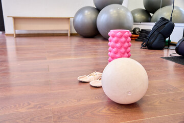 Gym floor with fitness equipment including exercise balls and foam roller © TRAVELARIUM