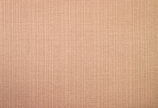 Natural beige fabric texture background with woven textile pattern.