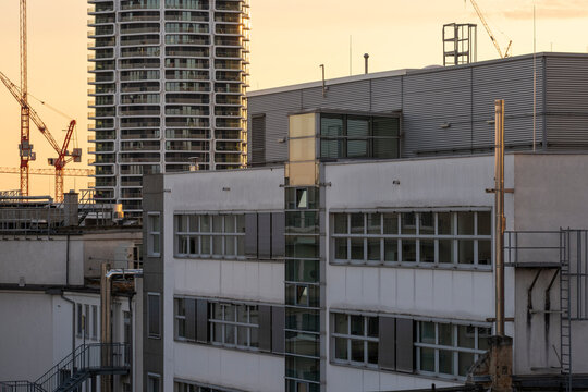 Frankfurt skyline with cranes shows urban construction and industrial development around buildings with strong infrastructure and architecture