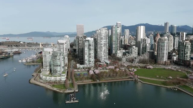 Towering Condominium Complex Within David Lam Park In Vancouver, British Columbia, Canada. Aerial Shot