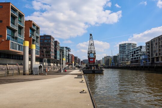 Hamburg, Germany - 15. April 2026: Hamburg HafenCity modern architecture and historic port crane
